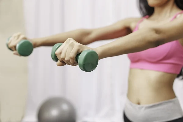 Woman exercising at the gum Royalty Free Stock Photos