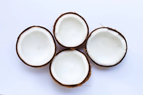 Halva Kokosnötter Vit Bakgrund Ovanifrån — Stockfoto