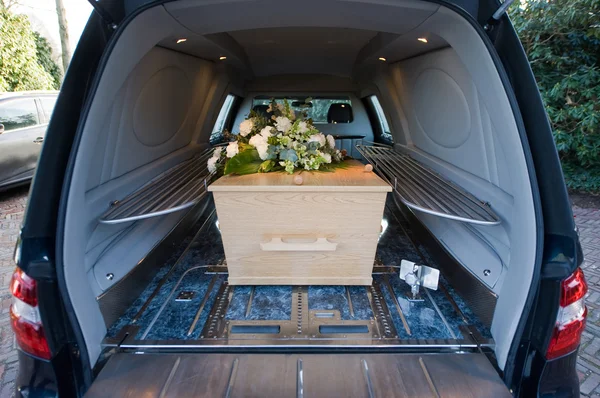 Coffin in car — Stock Photo, Image