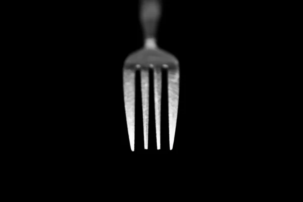 Fork isolated on a black background — Stock Photo, Image