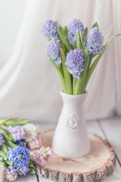 Vase with a large bouquet of hyacinth — Stock Photo, Image