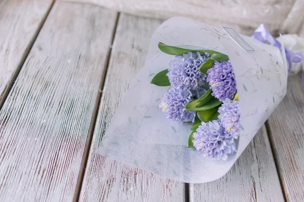 Bouquet of hyacinth on wooden boards — Stock Photo, Image