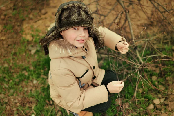 Boy in a cap with earflaps — Stok Foto