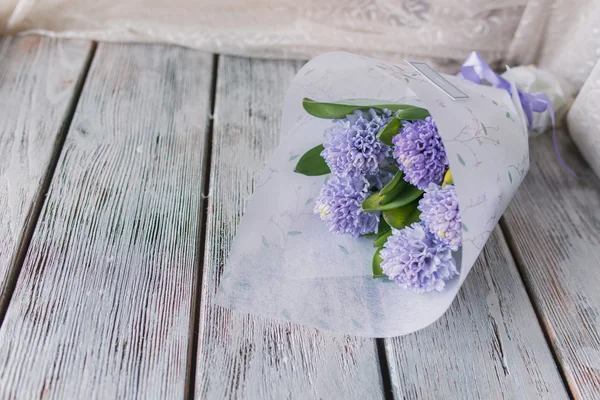 Bouquet of hyacinth on wooden boards — Stock Photo, Image