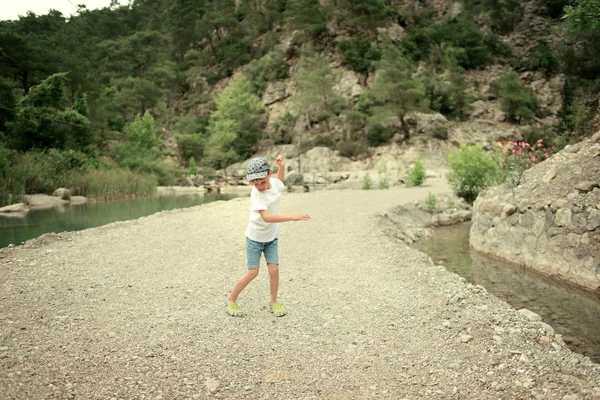 Boy by the river — Stock Photo, Image