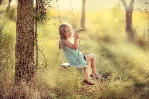 Girl on a swing — Stock Photo, Image