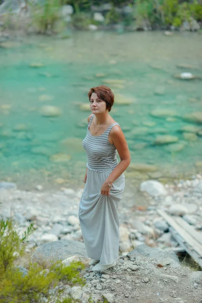 Woman at the river — Stock Photo, Image