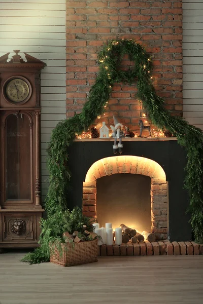 Fireplace with candles and pine needles — Stock Image Fireplace with candles and pine needles Royalty Free Stock Photos