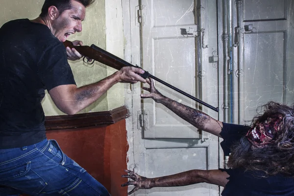 Zombie attack soldier with gun — Stock Photo, Image