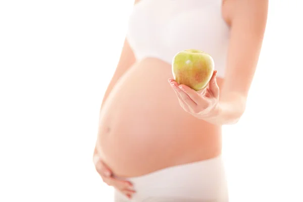 Zwangere vrouw met apple op de witte achtergrond — Stockfoto