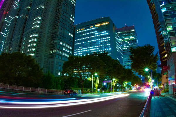 A night urban city street in Shinjuku wide shot. Shinjuku district Shinjuku Tokyo / Japan - 10.16.2020