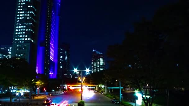 A night timelapse of the urban city street in Shinjuku wide shot panning — Stock Video