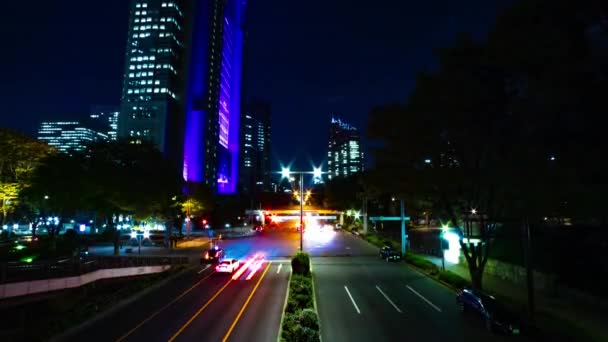 A night timelapse of the urban city street in Shinjuku wide shot tilt — Stock Video