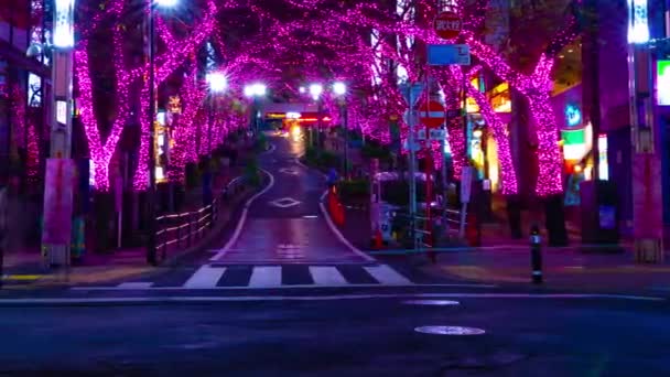 A night timelapse of the illuminated street in Shibuya panning — Stock Video