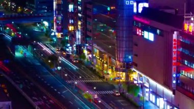 A night timelapse of the traffic jam at the crossing in Ginza long shot panning