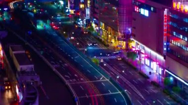 A night timelapse of the traffic jam at the crossing in Ginza long shot tilt