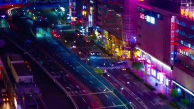 A night timelapse of the traffic jam at the crossing in Ginza long shot zoom