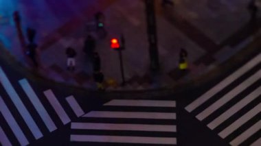 A night timelapse of the miniature traffic jam at the crossing in Ginza tiltshift zoom