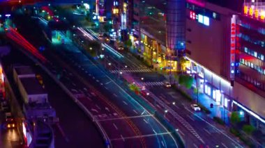 A night timelapse of the traffic jam at the crossing in Ginza long shot tilt