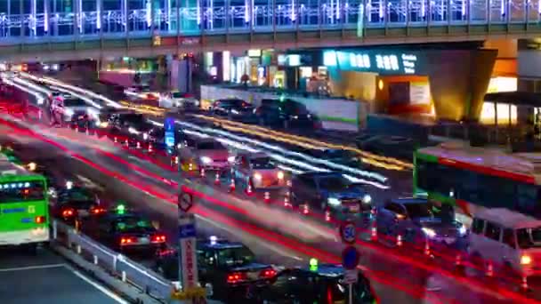 Een avond timelapse van de neon straat in Shibuya zoom — Stockvideo
