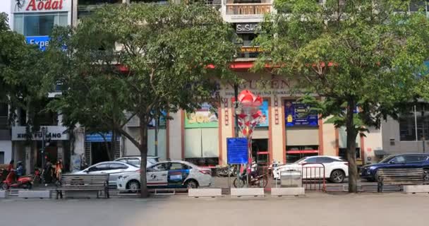 A colorful apartment at Nguyen Hue street in Ho Chi Minh handheld — Stock Video