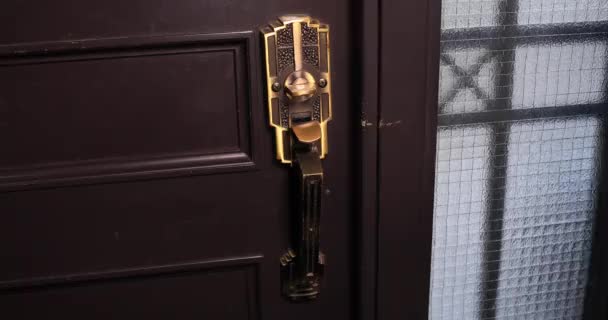 Disinfecting door knob by cleaner at the entrance — Stock Video