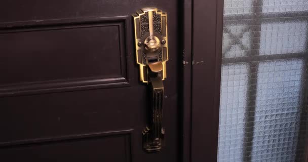 Disinfecting door knob by cleaner at the entrance — Stock Video