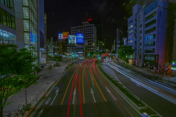 Uma cronologia noturna da rua urbana da cidade em Aoyama tiro largo — Fotografia de Stock
