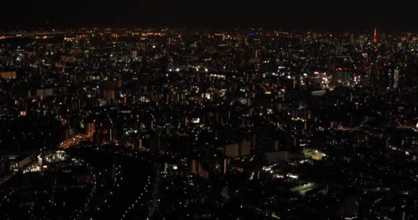 Noite aérea iluminada vista da cidade em Tóquio — Vídeo de Stock