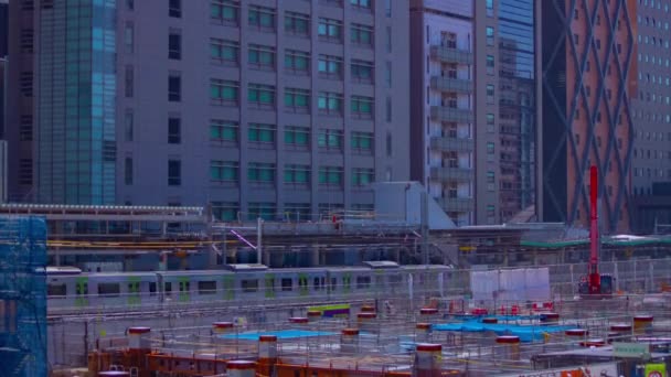 Sebuah tiLapse bergerak burung bangau di sedang dibangun di miring Shibuya — Stok Video