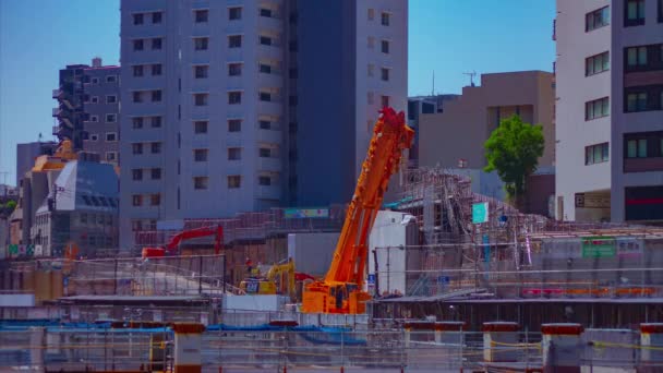 Een tijdspanne van bewegende kranen op de in aanbouw zijnde Shibuya long shot — Stockvideo