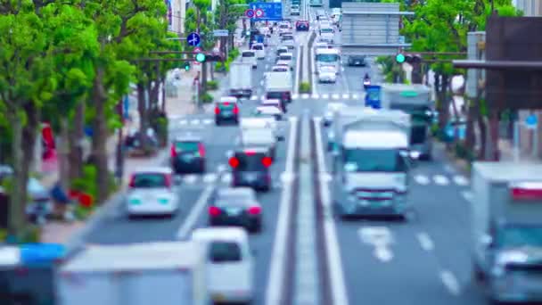 A timelapse of miniature traffic jam at the avenue daytime in the downtown tiltshift panning — Stock Video