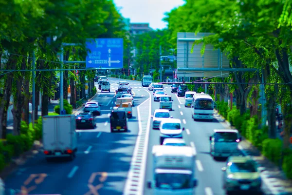 A miniature traffic jam at the avenue daytime in the downtown tiltshift — Stock Photo, Image