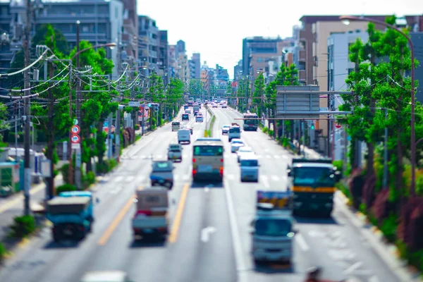 A miniature traffic jam at the avenue daytime in the downtown tiltshift — Stock Photo, Image