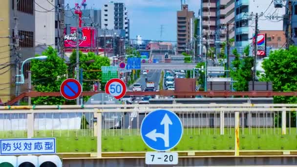 En timelapse av trafikstockning på centrum gatan i Tokyo dagtid långskott zoom — Stockvideo