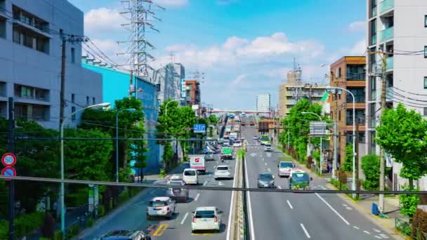 A timelapse of traffic jam at the downtown street in Tokyo daytime wide shot panning — Stock Video