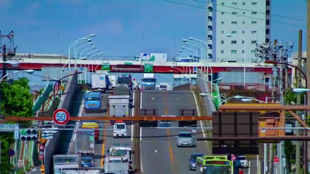 Um timelapse de engarrafamento na rua baixa em Tóquio durante o dia tiro longo panning — Vídeo de Stock