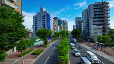 A timelapse of traffic jam at the avenue in the downtown in Tokyo wide shot panning