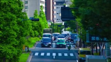 A timelapse of traffic jam at the avenue in the downtown in Tokyo long shot tilt