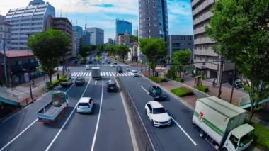 A timelapse of traffic jam at the avenue in the downtown in Tokyo fish eye shot panning