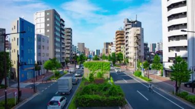 A timelapse of traffic jam at the avenue in the downtown in Tokyo wide shot zoom