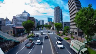 A timelapse of traffic jam at the avenue in the downtown in Tokyo fish eye shot tilt