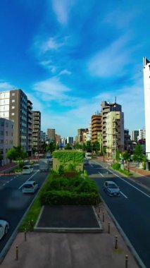 A timelapse of traffic jam at the avenue in the downtown in Tokyo vertical shot panning