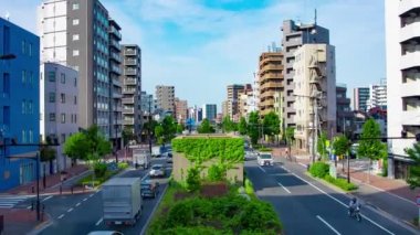 A timelapse of traffic jam at the avenue in the downtown in Tokyo wide shot zoom