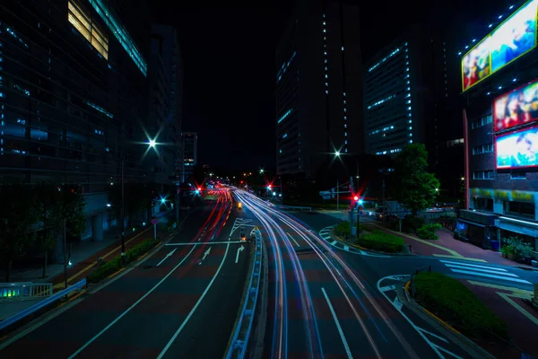 A night traffic jam at the city street in Aoyama wide shot — Zdjęcie stockowe