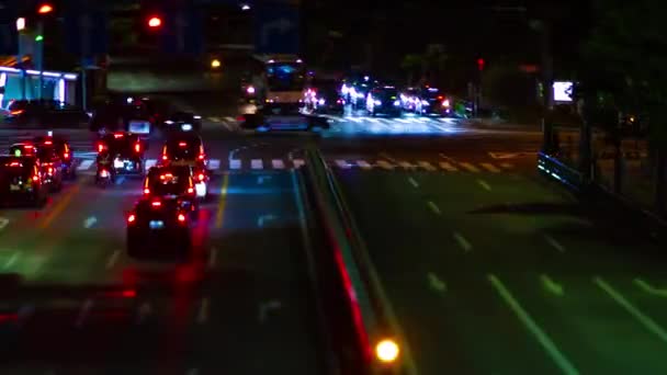 A night timelapse of miniature traffic jam at the city street in Aoyama tiltshift panning — Stock video