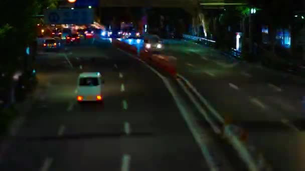 A night timelapse of miniature traffic jam at the downtown street tiltshift — Stock Video