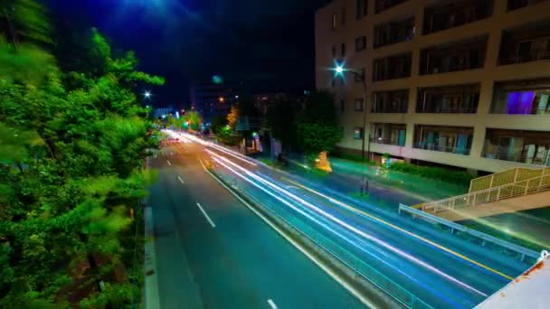 Um timelapse da noite do engarrafamento na rua baixa em Tóquio tiro largo panning — Vídeo de Stock