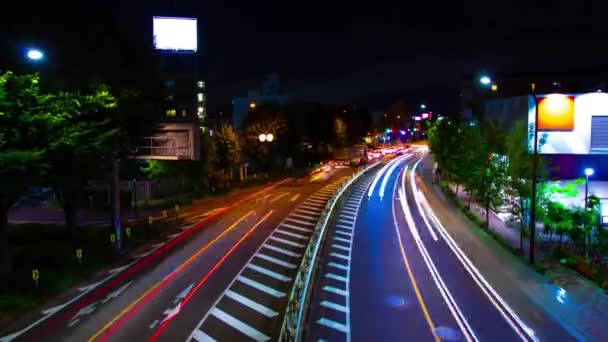 A night timelapse of traffic jam at the downtown street in Tokyo wide shot tilt — Stock Video