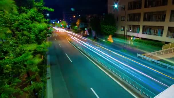 Un timelapse nocturno de atasco de tráfico en la calle del centro de Tokio zoom de tiro ancho — Vídeos de Stock